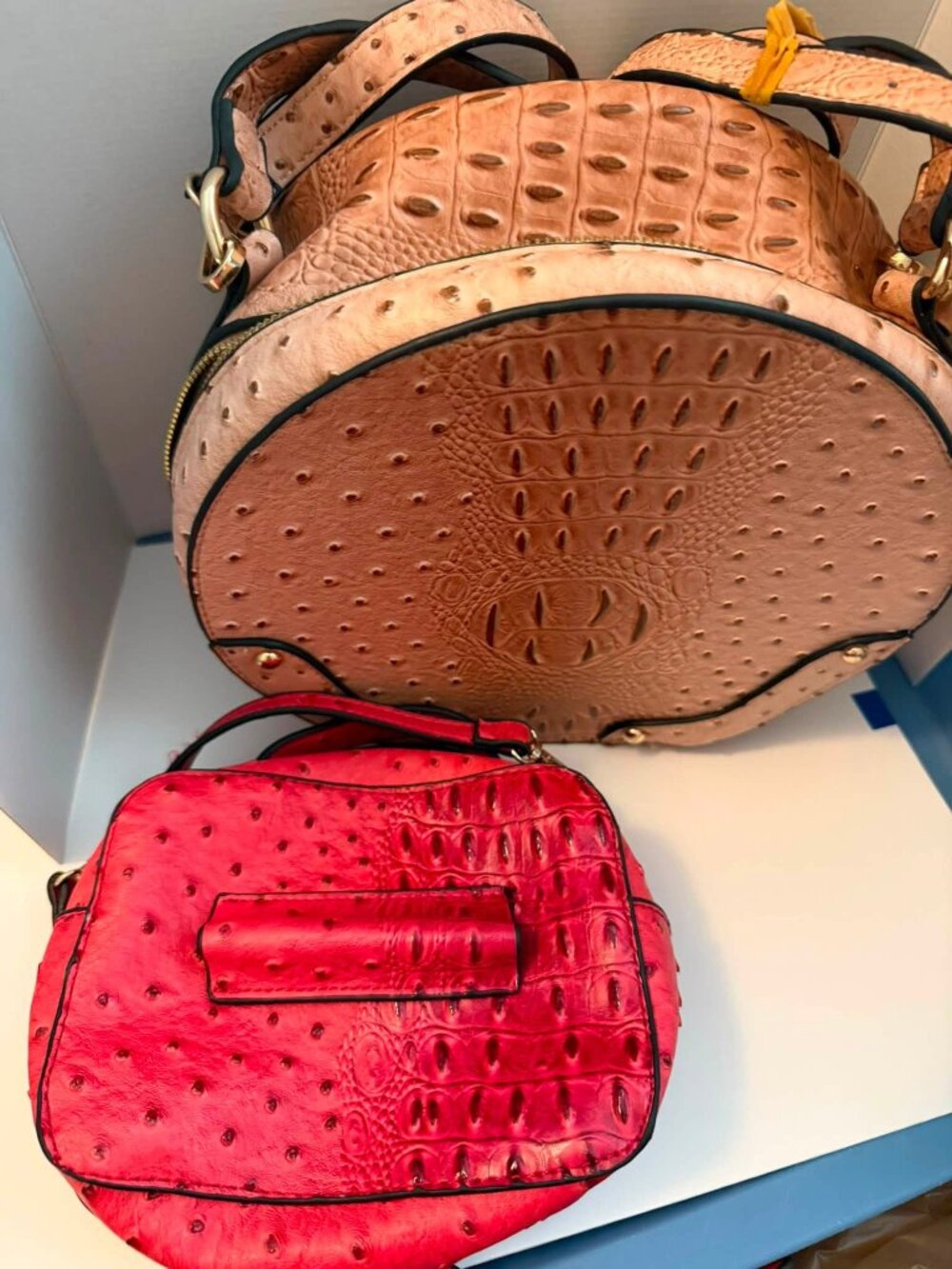 Ostrich round zip up handbag with small carry on inside